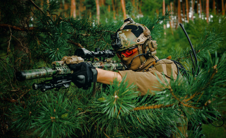 airsoft man with optical sight sniper rifle