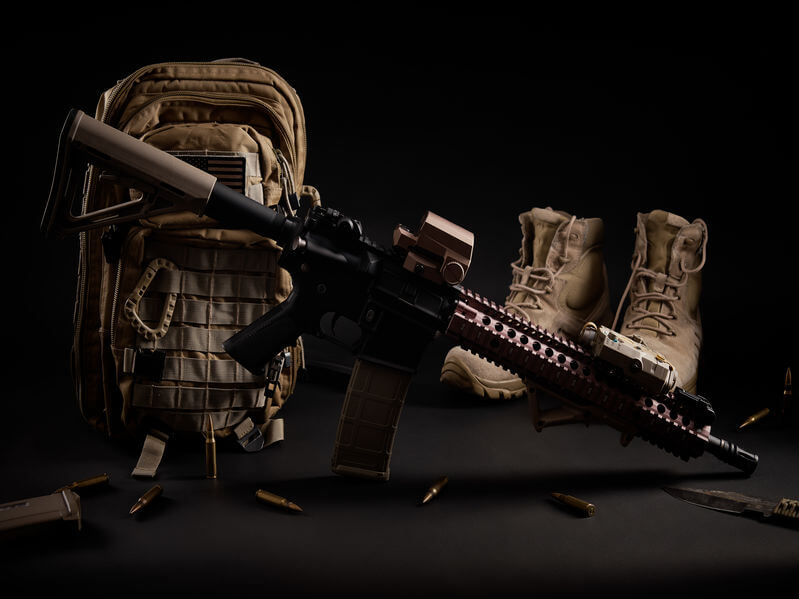 military backpack with an assault airsoft rifle