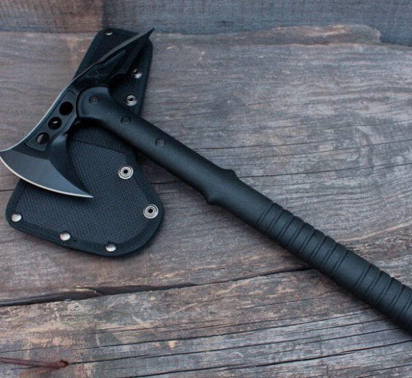 army axe tactical tomahawk on wood background