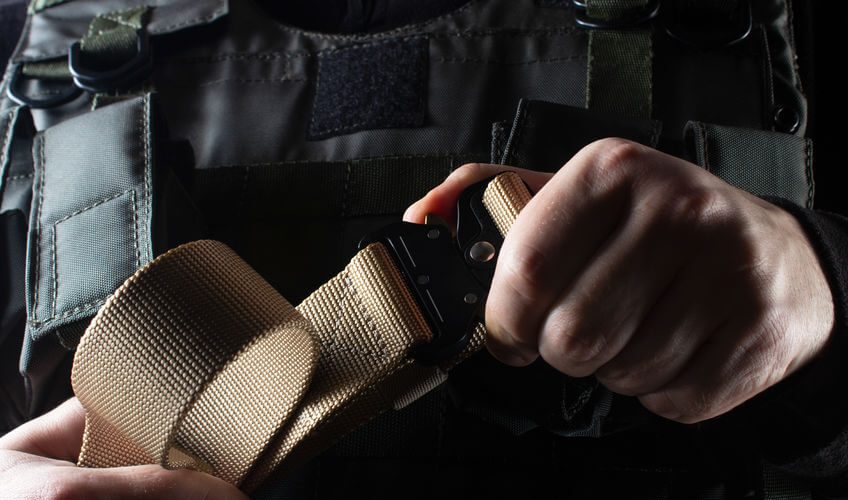 soldier in black armor tactical chest rig vest standing with belt