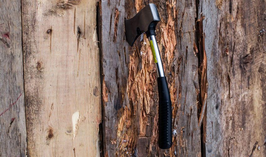 axe stuck in a wood board on axe throwing competition