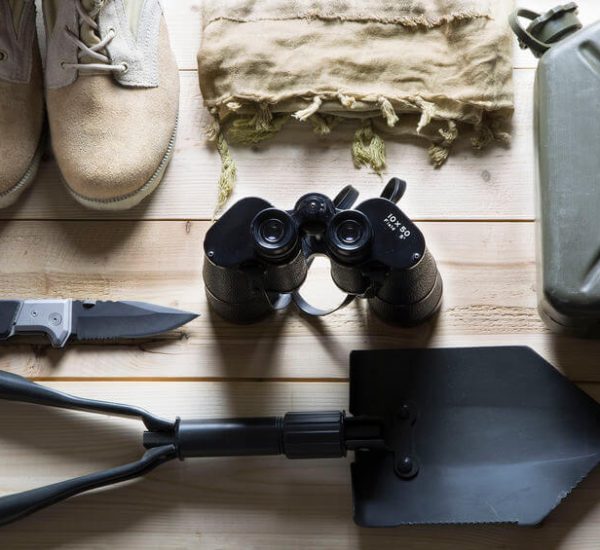 tactical shovel military knife boots binoculars and other survival equipment