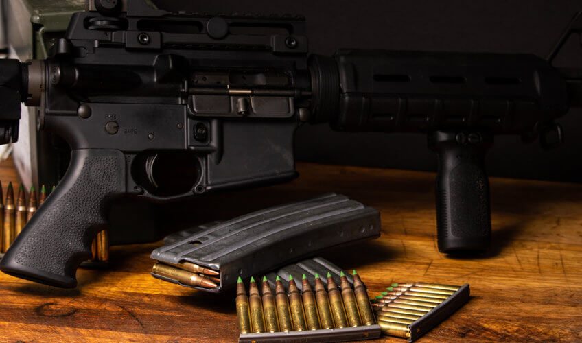 ammunition with gun on table