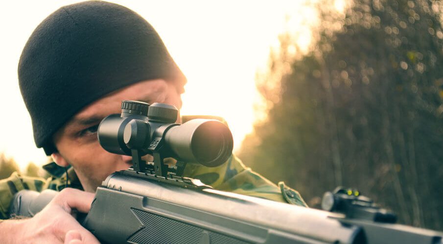 man aiming an airgun