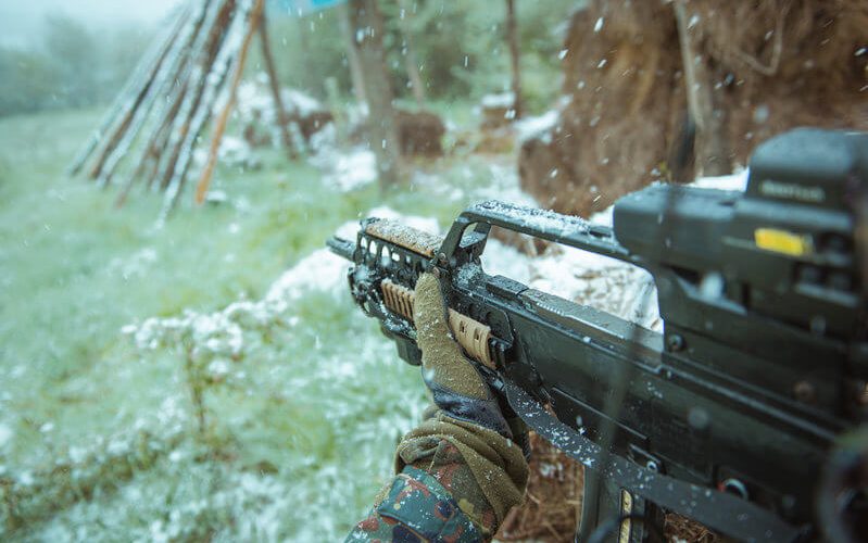 man aiming an airsoft gun