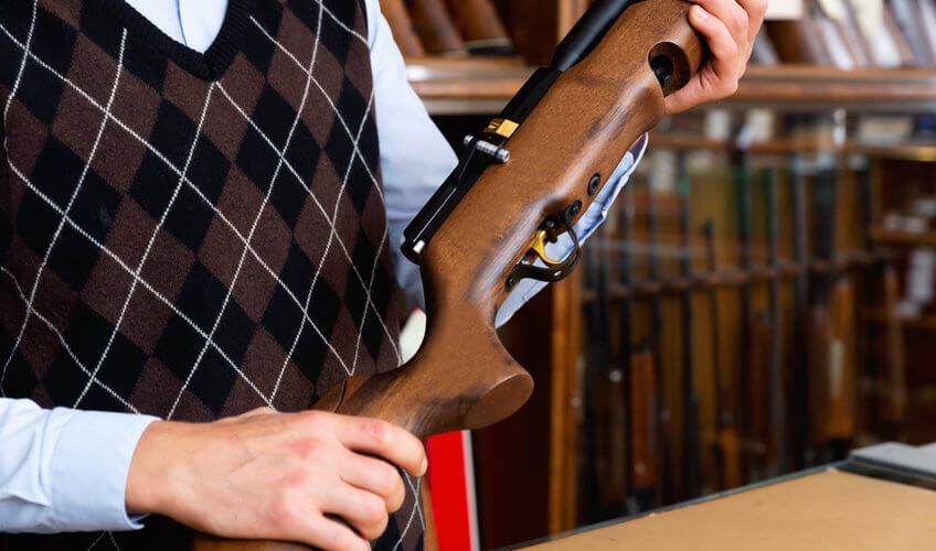 man holding a pcp air rifle