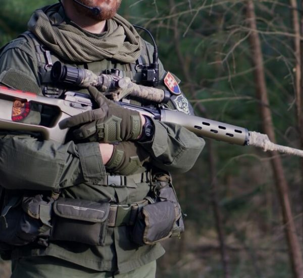 man holding airsoft sniper rifle