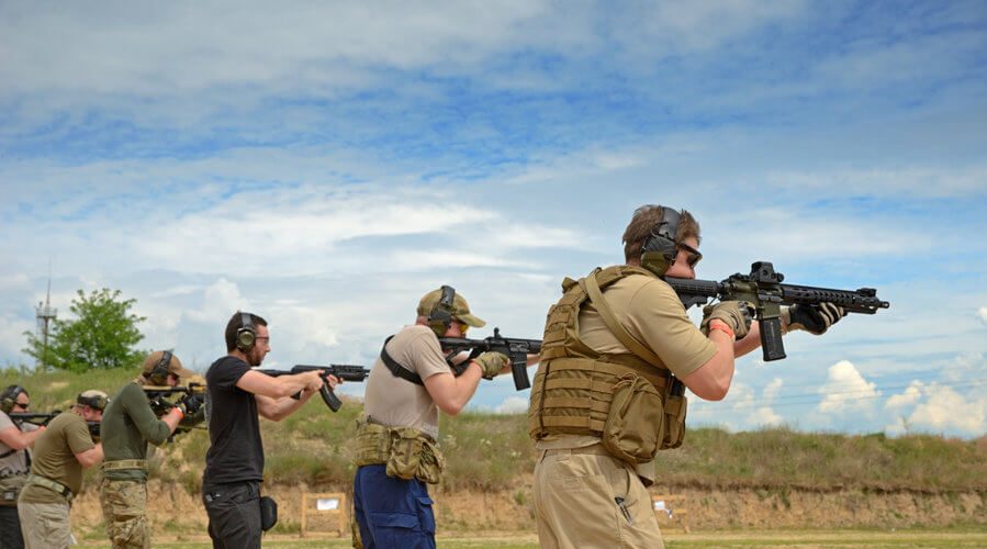 men training in shooting range