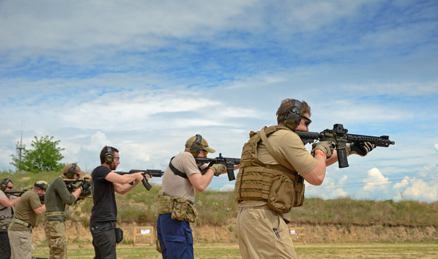 men training in shooting range