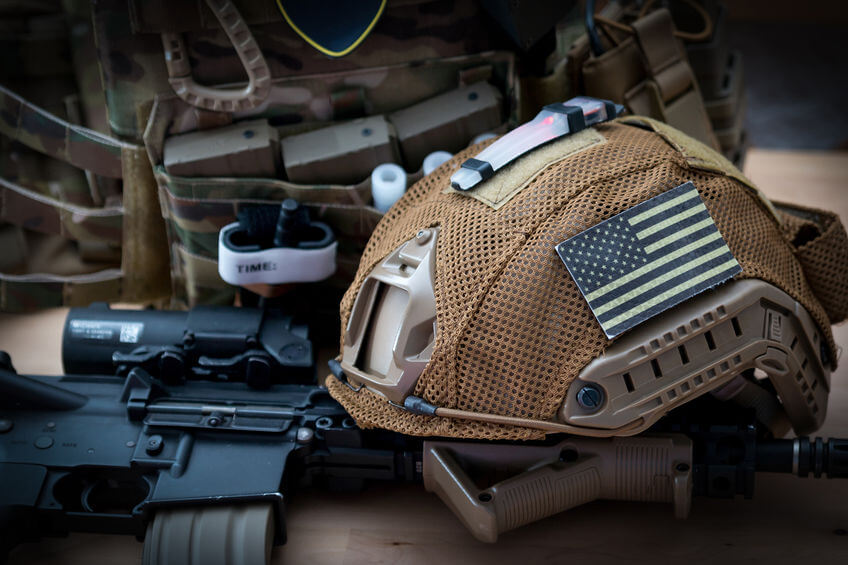 military equipment with a rifle and tactical helmet