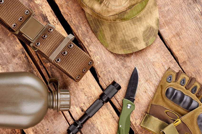 pocket knife an military gear on table