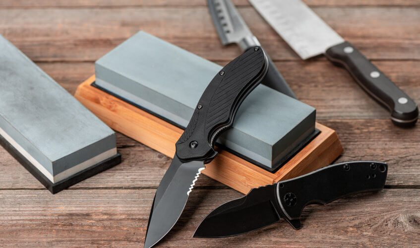 pocket knife and sharpener on table