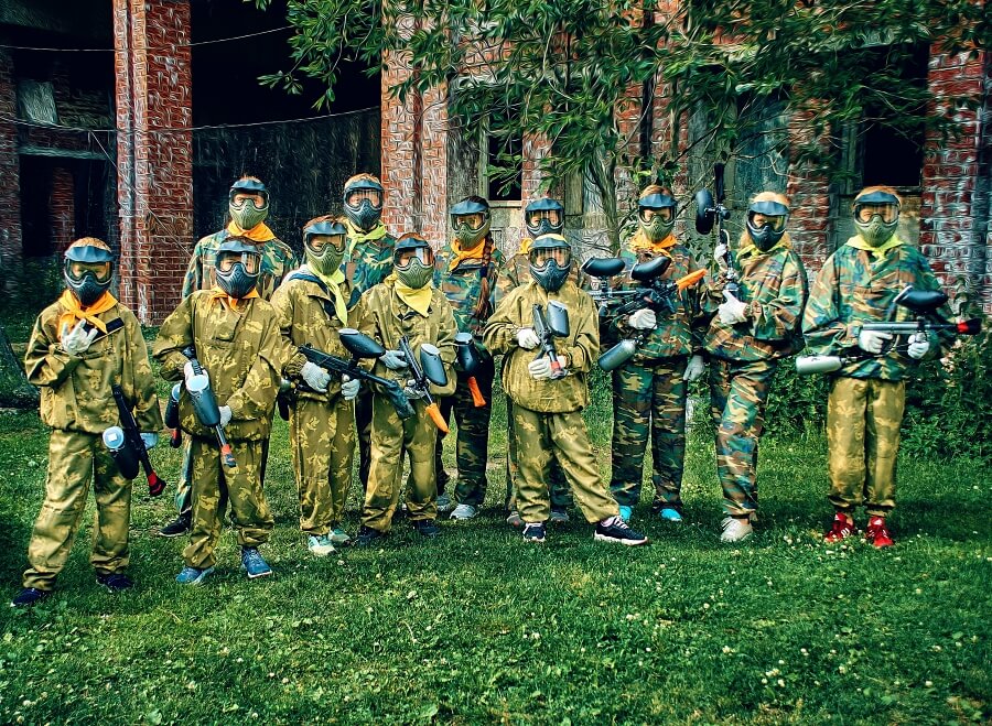 teenagers playing paintball