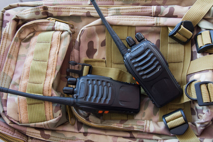 two walkie talkies on military bag