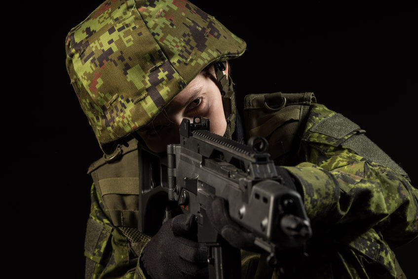 young female observe with airsoft rifle